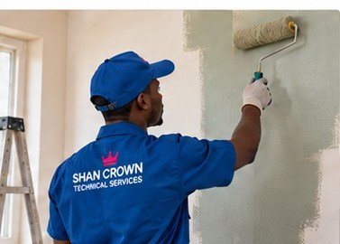 Shan Crown technician painting an interior wall
